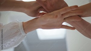 Woman hands dancing gracefully in art studio closeup. Female couple arms touch