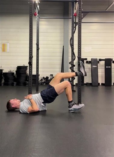 Single leg glute bridge to hamstring bridge drop and catch