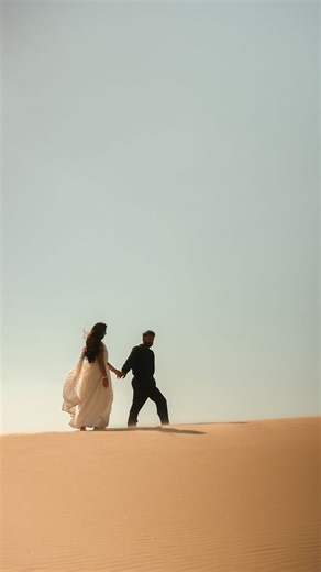 Purple Peacock Studios | Wedding Photographers & Videographers on Instagram: "our very bollywood-inspired engagement film — and V&A trusted us with sand dunes, a road trip, and their love story 🤍 this shoot was pure magic, romance, and full-on bollywood energy. so grateful for clients who turn into collaborators and memories like these. 📍sand dunes | photo + film by purple peacock studios // [engagement session, destination photographer, destination videographer, destination engagement session