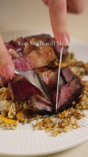 Koji Marinated Steak & Beef Dripping Fried rice Read about this technique of marinating steak in Koji that makes steaks taste like theh are dry aged in a day and finally went to try it. While its not like a traditional dry age i go get the hints of feemenration and really like the sweetness koji brings to the steak. The live enzymes also do breakdown the meat fibers making for a more tender steak. #steak #koji #fermentation #marinated #easyrecipe #dinnerideas #sgfoodie