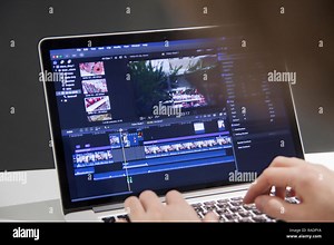 Video editing with laptop. Professional editor adding special effects or color grading footage for commercial film or movie. Man using software in com Stock Photo - Alamy