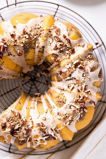 PRINT the recipe: https://www.wyseguide.com/grandmas-coffee-cake/ My grandma loving made this coffee cake for anyone who visited her. With cinnamon sugar and chopped pecans, you’re sure to make it for guests as well! INGREDIENTS⁠ ⁠ - 2 cups flour⁠ - 1/4 cup cornstarch⁠ - 1 1/2 cups sugar⁠ - 2 1/2 tsp baking powder⁠ - 1/2 tsp salt⁠ - 8 tbsp unsalted butter, room temperature⁠ - 1/2 cup vegetable oil⁠ - 3 eggs⁠ - 2 egg yolks⁠ - 1 cup milk⁠ - 2 tsp vanilla extract⁠ - 1/2 cup sour cream⁠ - 1 cup toas