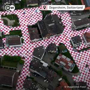 340K views · 978 reactions |  A gigantic picnic blanket that grows and grows: The annual BIG NIK by twin brothers Frank and Patrik Riklin in Switzerland now covers entire places - and invites everyone to picnic together! | DW Euromaxx | Facebook