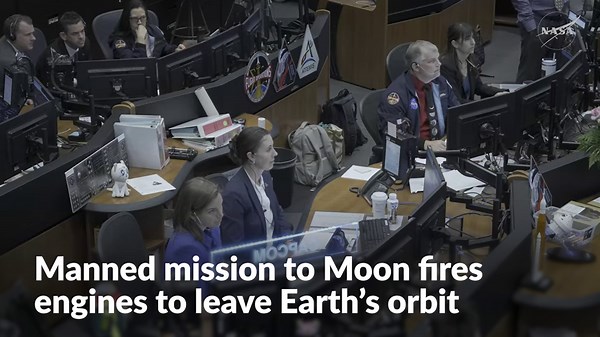 Manned mission to Moon fires engines to leave Earth's orbit