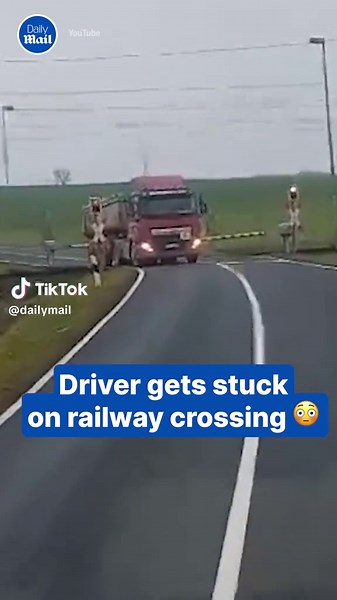 This is the heartpounding moment a truck driver stuck on a level crossing was forced to jump to safety seconds before a freight train destroyed his vehicle. #truck #semi #train #road #drive #dashcam