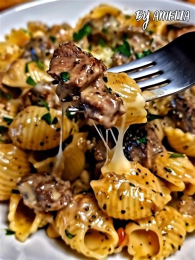 Creamy Garlic Steak Pasta Shells – Hearty, Cheesy & Packed with Flavor Tender steak bites tossed with pasta shells in a creamy garlic-Parmesan sauce. A comforting dinner that’s sure to impress! Ingredients 12 oz medium pasta shells 1 tbsp olive oil 1 lb sirloin steak or ribeye, cut into bite-sized pieces Salt & black pepper, to taste 1 tsp garlic powder 1 tsp Italian seasoning ½ tsp crushed red pepper flakes (optional) 4 cloves garlic, minced 1 cup beef broth 1 cup heavy cream ½ cup grated Parme