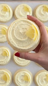 These frosted lemon cookies are here to brighten your feed and your dessert game! Recipe on cakemehometonight.com! | Cake Me Home Tonight