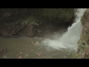 Wild Swim in the rain in the mountains cold river - swimming naked and free