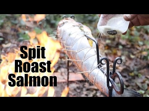 Whole Spit-Roast Salmon Cooked over a Campfire. Christmas 2021.