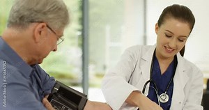 4K Friendly female doctor giving medical check to cheerful senior man Stock Video