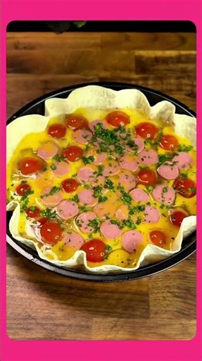 Place crust on bottom,pour in three beaten eggs,add seasonings,vegetables,tomato, then bake in oven.