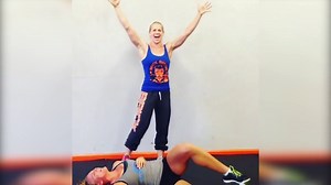 Maddy Curley deadlifts her friend and then drops her