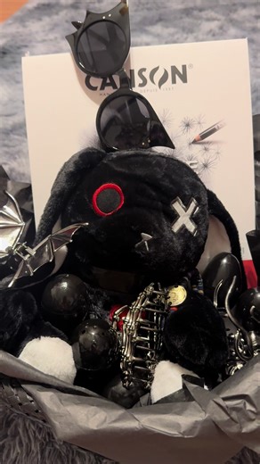 Not your typical Easter basket… and that’s kind of the point 🖤 We really try to be intentional with what we bring into our home. Less plastic “just because” stuff, more things that actually get used and loved. My younger two got things to help me in the garden this year 🌱 But my oldest? She’s got her own style… and I’ll never leave her out. So this was her “alt” Easter basket, made just for her 🖤 A plush bunny (because she still loves soft things), bat wing sunglasses for summer, hair clips s