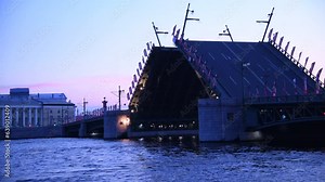 Side view of opening bascule bridge at twilight (early morning) in Saint Petersburg city, Russia. Transportation uilding. Real time video. Russian text on flags translation: fire department.