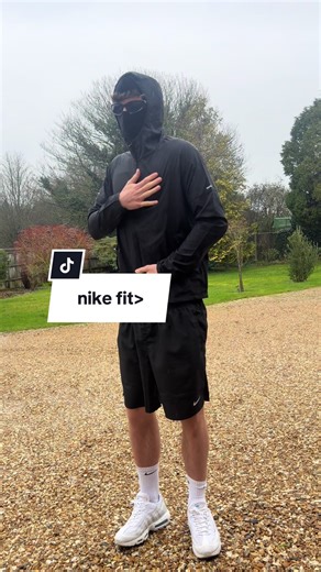 Men's Fashion: Styling Large Shorts and Medium Windbreakers