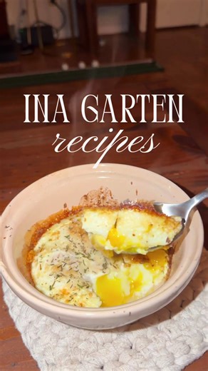 Ina Garten’s Herb Baked Egg🍳 1/2 teaspoon minced fresh garlic 1/2 teaspoon minced fresh thyme leaves 1/2 teaspoon minced fresh rosemary leaves 2 tablespoons minced fresh parsley 2 tablespoons freshly grated Parmesan cheese 12 extra-large eggs 1/4 cup heavy cream 2 tablespoons unsalted butter Kosher salt Freshly ground black pepper Preheat the broiler. Combine the garlic, thyme, rosemary, parsley, and Parmesan cheese and set aside. Carefully crack 3 eggs into each of 4 small bowls without breaki