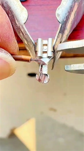 Wire crimping process shows accurate electrical work technique