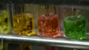 Automatic machine for pouring medicine into ampoules or test tubes.