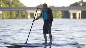 Stand-up paddleboarding is a workout on the water