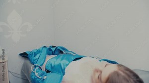 Beauty salon. Hardware figure correction. Machine cosmetology. Woman on pressure therapy procedure. Anti-cellulite program for health and slimming. Professional equipment for cosmetic clinic.