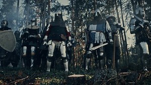 Epic Invading Army of Medieval Soldiers Marching on Battlefield, Armored Warriors with Swords, Getting Ready to Attack. War, Battle, Conquest. Historical Reenactment. Cinematic Low Angle Wide Shot