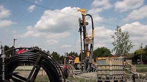 Geothermal Drilling Rig Drills Geothermal Water Well in Residential Area. Geothermal Drilling Rig. EU Countries Invest in Geothermal Energy. Renewable Energy Source. Green Energy.