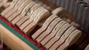 Small felt hammers inside the piano hitting the strings. Music and instruments concept