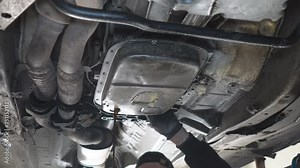 Automatic transmission disassembly in a car service center. The structure of a disassembled automatic transmission of a passenger car, bottom view with the cover removed