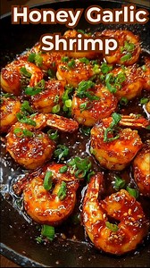 Honey Garlic Shrimp Skillet Sticky, glossy, and bursting with bold flavor, this Honey Garlic Shrimp is the kind of recipe you make once—and then save forever. It’s fast, irresistible, and perfect for busy nights when you still want something seriously delicious. 🛒 Ingredients For the Shrimp 1 lb large shrimp, peeled and deveined 2 tbsp olive oil Salt, to taste Black pepper, to taste ¼ tsp red pepper flakes (optional) 2–3 green onions, sliced (for garnish) For the Honey Garlic Sauce ¼ cup honey 
