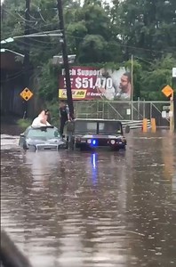 NJ Police Use Humvee to Rescue Bride And Groom Stranded in Flooded Car