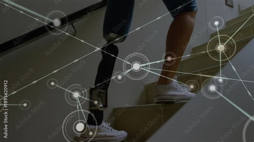 Senior woman placing prosthetic foot on stair, activating health overlay, climbing toward landing