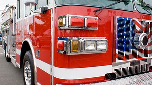Sound of explosion alerts volunteer firefighter to neighbor's garage fire