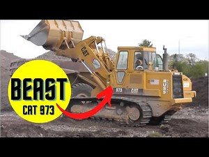 CAT 973 Loading Trucks