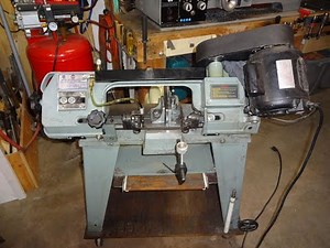 Metal bandsaw blade guide adjustment