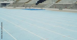 Black woman winning a race and celebrating while crossing the finish line. Runner beating the competition and cheering on a sports track. Female athlete showing speed and endurance to earn victory