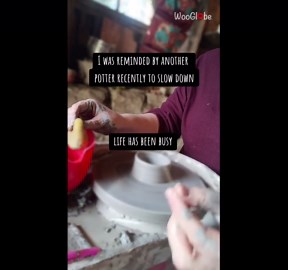 Artist shapes mugs from clay during calm pottery studio session