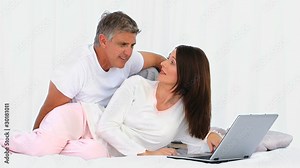 Middle aged couple using a laptop