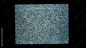 Static noise on an analog TV screen, signal lost. Zoom out.