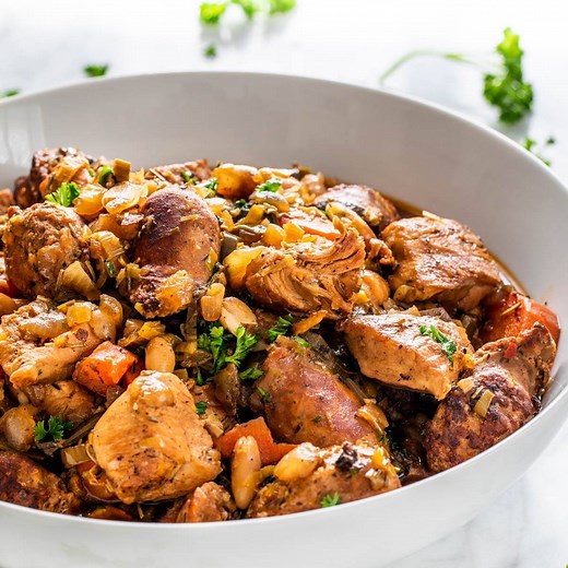 This Classic French Cassoulet is a classic and simple yet delicious casserole with beans, pork sausage and chicken breast. Served with a french baguette and salad? Oui Oui! RECIPE --- https://www.jocooks.com/recipes/classic-french-cassoulet/ | JoCooks