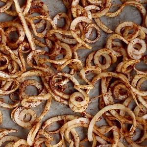 A healthy twist on savory snacking- BAKED CURLY FRIES made with NO OIL! Seriously addictive, crispy, and the perfect way to enjoy veggies! {whole30, vegan, paleo} https://thebigmansworld.com/2017/02/22/healthy-oil-free-baked-curly-fries/ | The Big Man's World