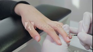 Manicure process in a beauty SPA salon close up. Professional manicurist in gloves paint nails with natural gel polish in luxury salon. Concept nails and hands care Stock Video