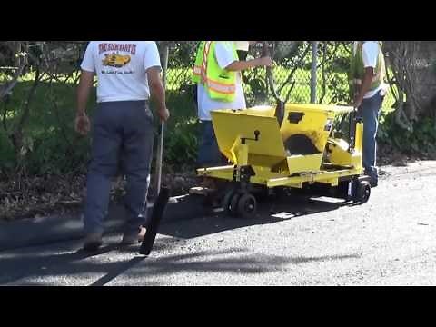 Miller Curber MC 550 extruding an asphalt curb
