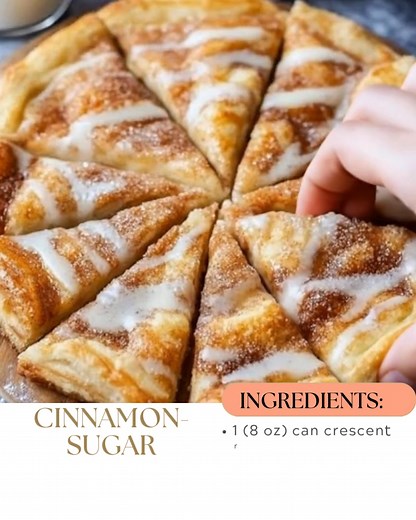 Cinnamon-Sugar Crescent Roll Pizza This buttery, puffed-up treat is layered with cinnamon-sugar goodness and drizzled in sweet vanilla glaze—it’s like a dessert pizza dream come true. 📝 Ingredients: For the Pizza: 1 (8 oz) can crescent roll dough 2 tablespoons unsalted butter, melted 1/4 cup granulated sugar 1 teaspoon ground cinnamon For the Glaze: 1/2 cup powdered sugar 1–2 tablespoons milk 1/4 teaspoon vanilla extract 🍽️ How to Make It: Prep the Dough: Preheat oven to 375°F (190°C) and line