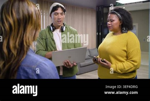 Upon gathering in lounge, Diverse coworkers discussing project proposal using laptop and tablet. Collaboration, teamwork, innovation, communication, modernity, engagement, professionalism Stock Video Footage - Alamy