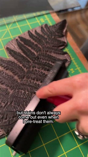 Upcycling a thrifted hoodie with snake, fern, and frog stamps