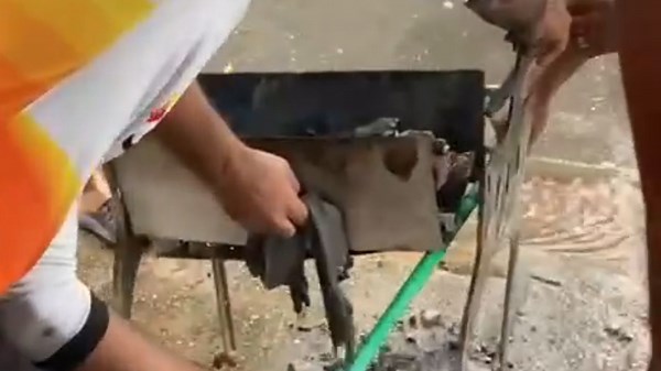 Friends try to grill meat but their barbecue grill falls apart in a funny way