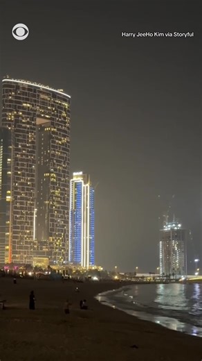 Missiles were seen in the sky over Dubai on Saturday as Iranian forces launched retaliatory strikes following U.S. and Israeli strikes on Iran. Video shows smoke and projectiles in the sky near Dubai Marina. | CBS News