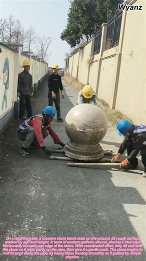 workers moving large stone block by rolling with steel pipes | daily construction routine