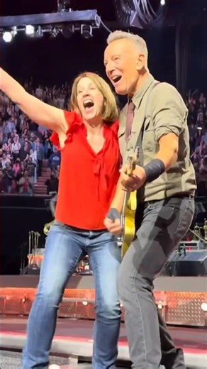 Bruce Springsteen invites a fan to dance during “Twist and Shout” at the Kia Forum (April 4, 2024)