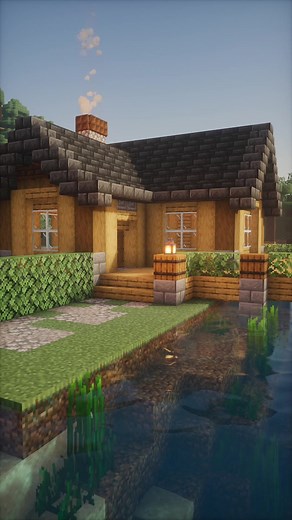 A build idea for a lake house in Minecraft. Cabin-like style with easy to copy features. Photon shaders with no texture pack. #minecraft #minecraftbuilds #minecrafttutorial